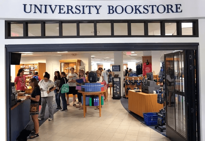 A line of students wait at the University bookstore.