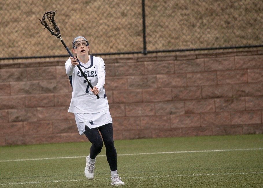 Paige Haskins catches the ball with her stick.