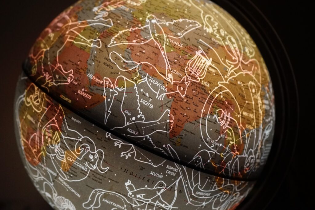 A dark globe with the constellations outlined on the surface.