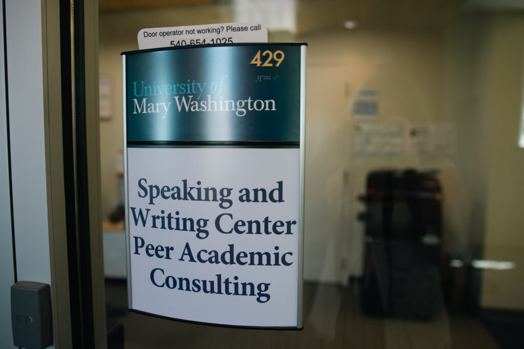 The Speaking and Writing Center Peer Academic Consulting Sign located on the fourth floor of the Hurley Convergence Center.