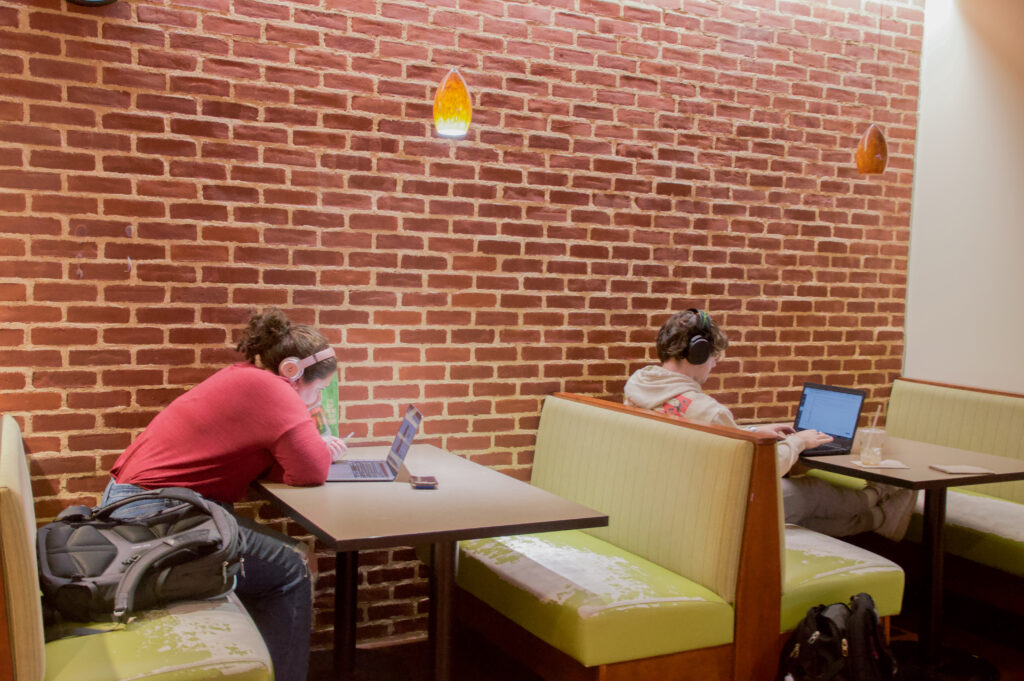 Photograph of students studying in Panera.