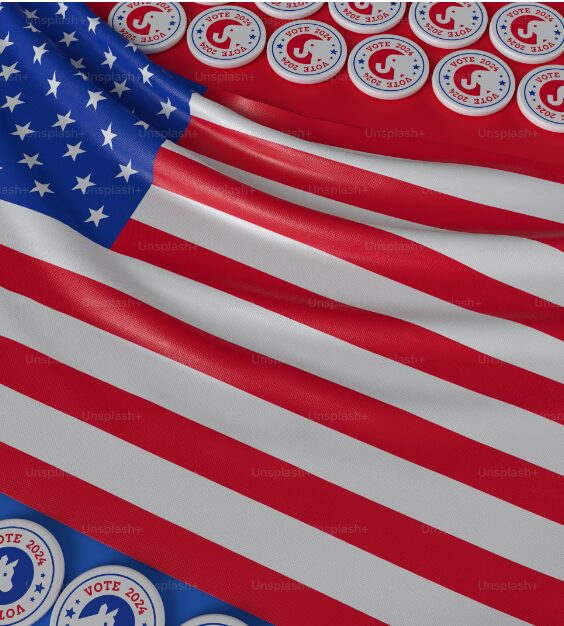 A digital image of a USA flag with both republican and democratic buttons surrounding it.